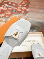lv capri flat mule white calfskin