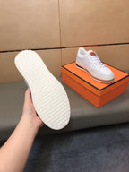 LV TRAINER IN EMBOSSED WHITE SUEDE