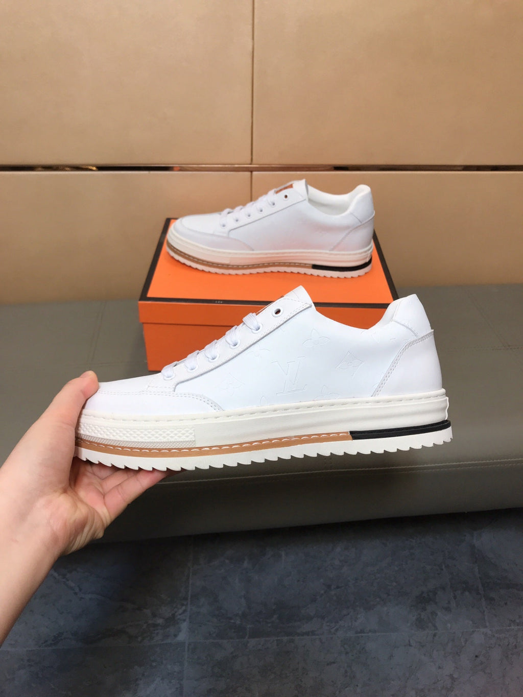 LV TRAINER IN EMBOSSED WHITE SUEDE