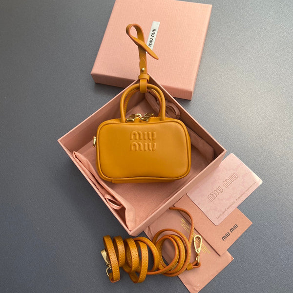 MICRO BAG KEYCHAIN 11  IN INDOCHINE ORANGE CALFSKIN EMBOSSED LOGO