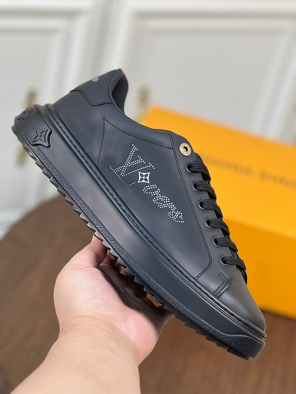 LV TIME OUT SNEAKER IN BLACK CALFSKIN