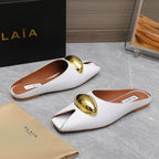 ALAIA FLAT MULE IN WHITE LAMBSKIN WITH GOLD HARDWARE