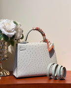KELLY SELLIER 25 BAG IN PALE GRAY OSTRICH LEATHER WITH SILVER HARDWARE (MADE - TO - ODER)