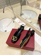 VLOGO BLACK LEATHER SLINGBACK FLATS