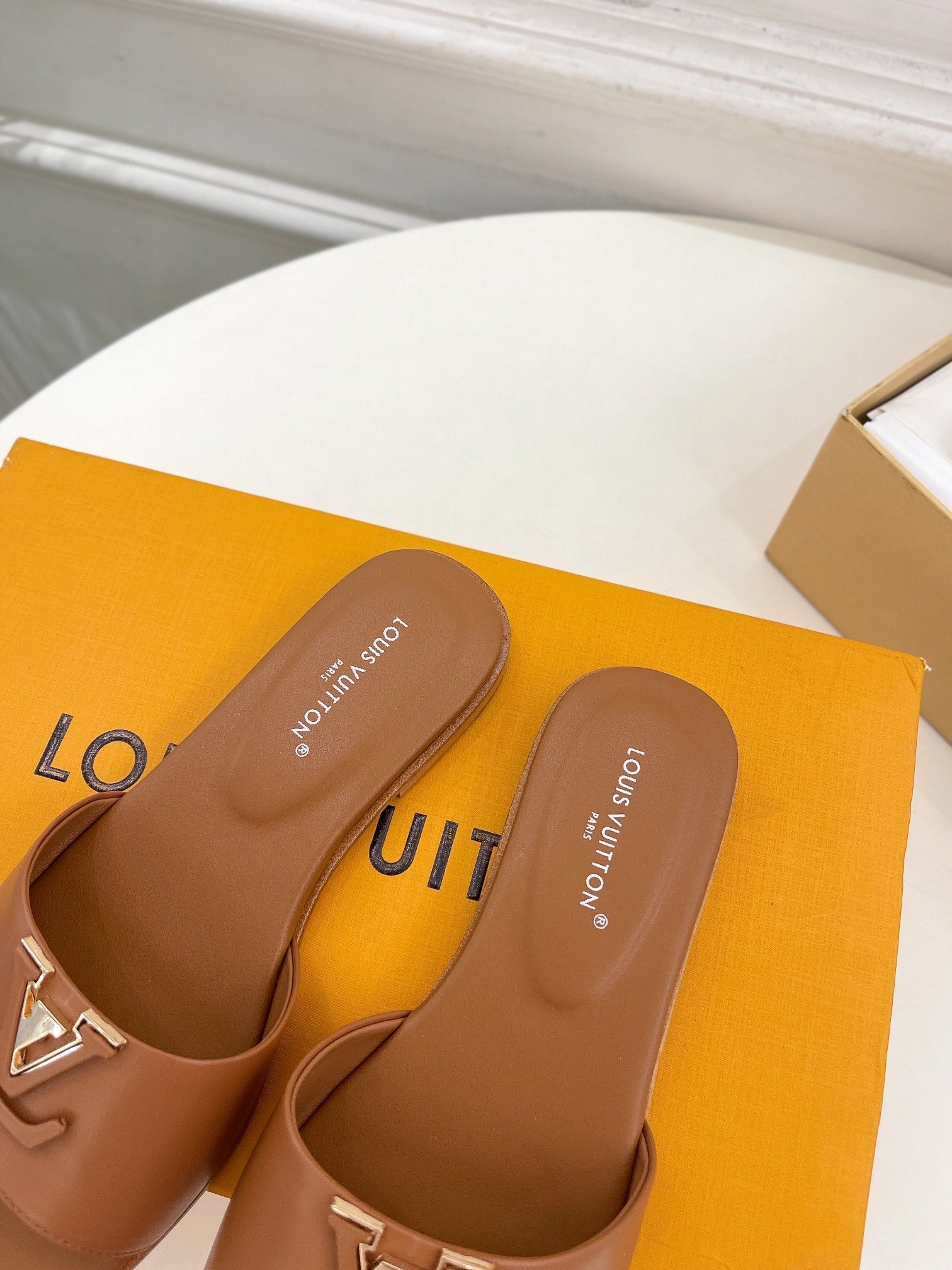 lv capri flat mule dark brown calfskin