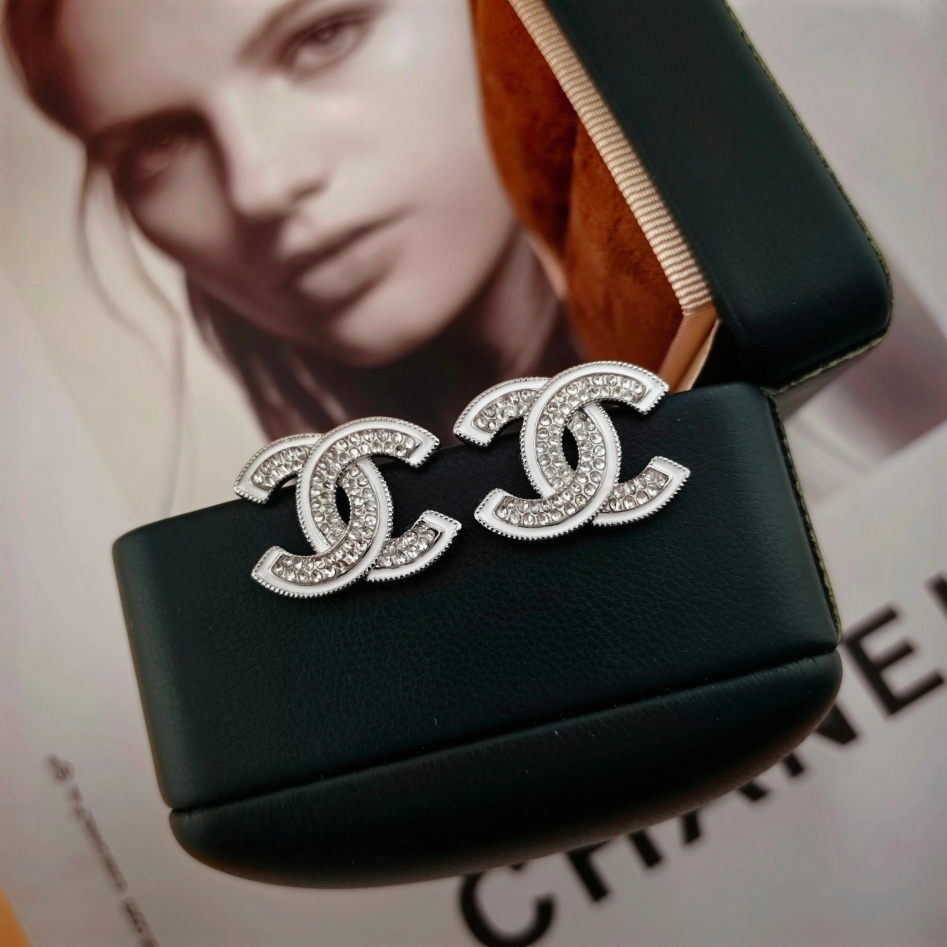 DOUBLE C STUD EARRINGS WITH WHITE TRIM AND CLEAR STONE LOGO