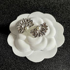 DOUBLE C STUD EARRINGS IN HALF-FLOWER SHAPE WITH PEARL CENTER