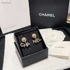 LETTERS CRYSTALS EARRINGS IN METAL GOLD WITH PEARLS
