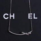 CHANE RUBAN BOW SILVER DIAMOND NECKLACE